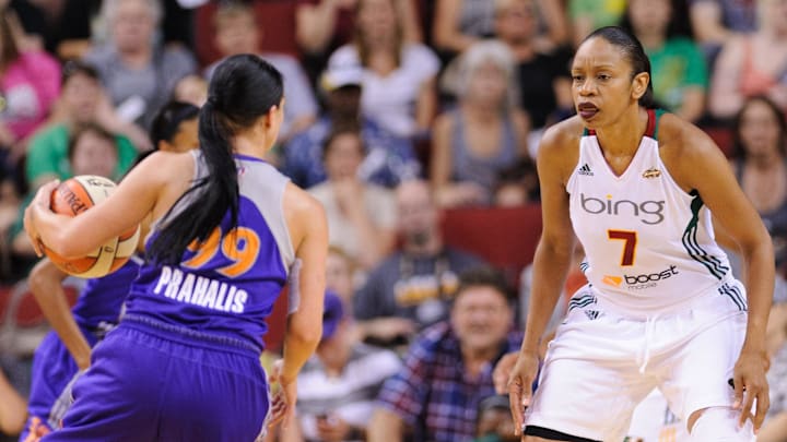 Aug 16, 2012; Seattle, WA, USA; Seattle Storm forward Tina Thompson (7) guards Phoenix Mercury guard Samantha Prahalis (99) during the 1st half at KeyArena. Seattle defeated Phoenix 72-58. Mandatory Credit: Steven Bisig-Imagn Images