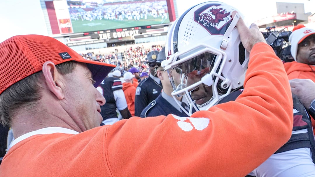 Clemson head coach Dabo Swinney talks with South Carolina running back Matt Fuller (28) after the Tigers’ 28-14 win at Williams-Brice Stadium in Columbia, S.C. Saturday, November 29, 2025.