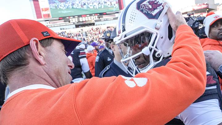 Clemson head coach Dabo Swinney talks with South Carolina running back Matt Fuller (28) after the Tigers’ 28-14 win at Williams-Brice Stadium in Columbia, S.C. Saturday, November 29, 2025.