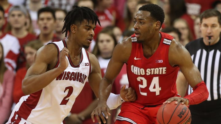 Feb 9, 2020; Madison, Wisconsin, USA; Ohio State Buckeyes forward Andre Wesson (24) works the ball against Wisconsin Badgers forward Aleem Ford (2) at the Kohl Center. Mandatory Credit: Mary Langenfeld-USA TODAY Sports