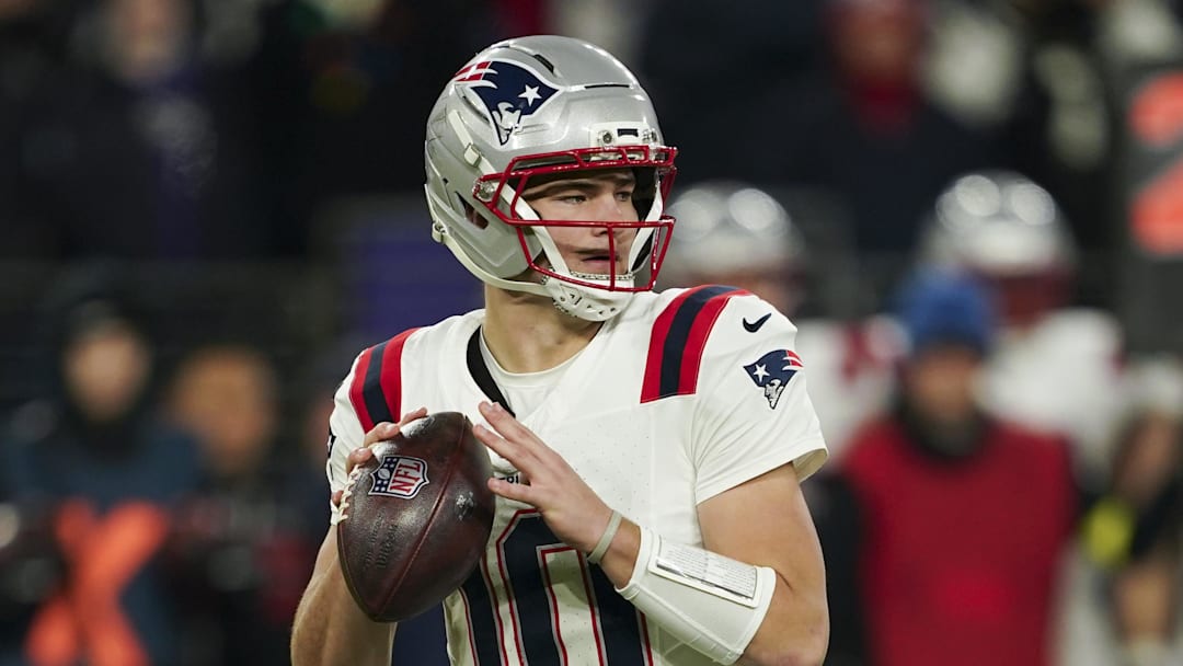 Dec 21, 2025; Baltimore, Maryland, USA;  New England Patriots quarterback Drake Maye (10) looks to pass against the Baltimore Ravens during the first half of the game at M&T Bank Stadium. Mandatory Credit: Mitch Stringer-Imagn Images