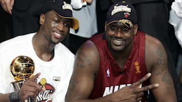 Dwayne Wade (L) and Shaquille O'Neal (R)