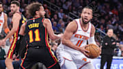 New York Knicks guard Jalen Brunson (11) looks to post up against Atlanta Hawks guard Trae Young (11) in the second quarter at Madison Square Garden. 