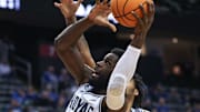 Feb 7, 2024; Newark, New Jersey, USA; Georgetown Hoyas forward Supreme Cook (24) drives for a shot in front of Seton Hall Pirates guard Dre Davis (14) during the first half at Prudential Center. Mandatory Credit: Vincent Carchietta-Imagn Images