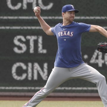 May 24, 2023; Pittsburgh, Pennsylvania, USA; Texas Rangers pitcher Jacob deGrom (48) throws in the outfield before the game against the Pittsburgh Pirates at PNC Park. 