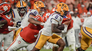 Louisiana State University receiver Zavion Thomas (0) runs near Clemson defensive lineman Peter Woods (11) during the first quarter at Memorial Stadium in Clemson, S.C. Saturday, August 31, 2025.