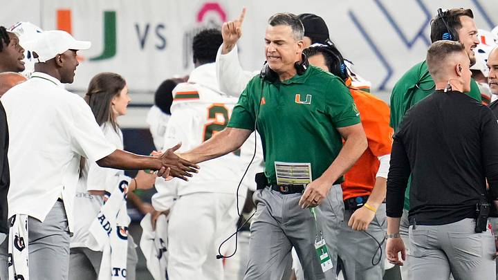 Miami Hurricanes head coach Mario Cristobal celebrates during the Cotton Bowl at AT&T Stadium in Arlington, Texas for the College Football Playoff quarterfinal game against the Ohio State Buckeyes on Dec. 31, 2025. Ohio State lost 24-14.