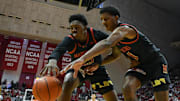 Jan 26, 2025; Bloomington, Indiana, USA; Maryland Terrapins center Derik Queen (25) and Maryland Terrapins forward Julian Reese (10) go for a loose ball during the first half against the Indiana Hoosiers at Simon Skjodt Assembly Hall. Mandatory Credit: Robert Goddin-Imagn Images