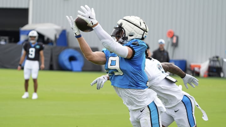 Jul 30, 2024; Charlotte, NC, USA; Carolina Panthers wide receiver Adam Thielen (19) reaches out for a reception against cornerback Jaycee Horn (8) during training camp at Carolina Panthers Practice Fields.