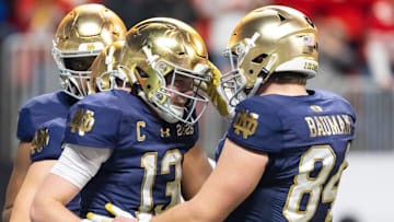 Notre Dame Fighting Irish quarterback Riley Leonard (13) celebrates a touchdown with tight end Kevin Bauman (84) against the Ohio State Buckeyes