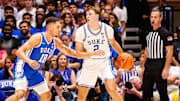 Oct 4, 2024; Durham, NC, USA; Duke Blue Devils guard Cooper Flagg (2) dribbles the ball against forward Mason Gillis (18) with the ball during Countdown to Craziness at Cameron Indoor Stadium. Mandatory Credit: Jaylynn Nash-Imagn Images