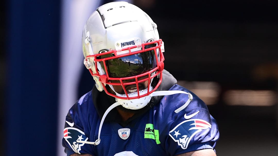 Former New England Patriots linebacker Ja'Whaun Bentley (8) walks to the practice fields for minicamp at Gillette Stadium.