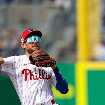 Mar 4, 2025; Clearwater, Florida, USA; Philadelphia Phillies shortstop Trea Turner (7) throws to first base against the New York Yankees in the third inning during spring training at BayCare Ballpark. / Nathan Ray Seebeck-Imagn Images
