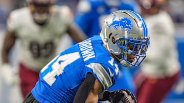 Detroit Lions wide receiver Amon-Ra St. Brown (14) catches a pass late in the fourth quarter during the NFL game against the Washington Commanders at Ford Field in Detroit, Mich, Saturday, Jan. 18, 2025.