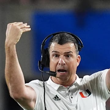 Dec 28, 2024; Orlando, FL, USA; Miami Hurricanes head coach Mario Cristobal reacts during the second half against the Iowa State Cyclones at Camping World Stadium. Mandatory Credit: Jasen Vinlove-Imagn Images