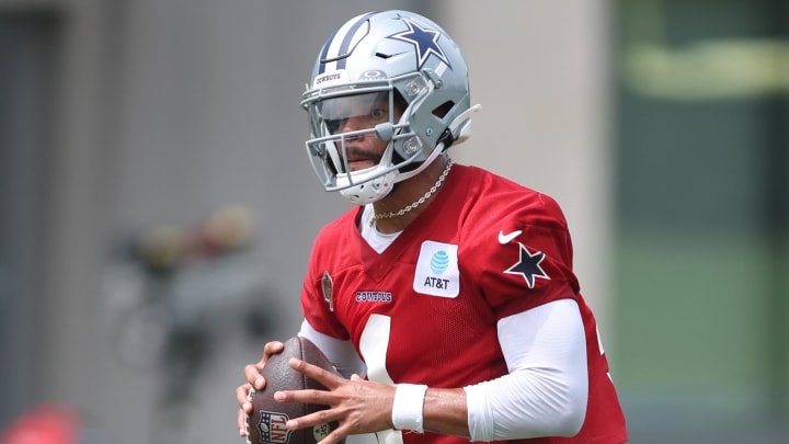 Jun 4, 2024; Frisco, TX, USA;  Dallas Cowboys quarterback Dak Prescott (4) goes through a drill during practice at the Ford Center at the Star Training Facility in Frisco, Texas. Mandatory Credit: Tim Heitman-USA TODAY Sports