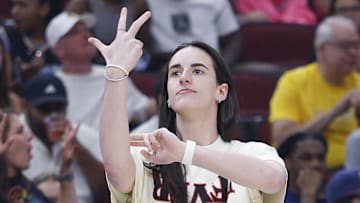 Jul 27, 2025; Chicago, Illinois, USA; Injured Indiana Fever guard Caitlin Clark (22) reacts during the first half of a basketball game against the Chicago Sky at United Center. Mandatory Credit: Kamil Krzaczynski-Imagn Images