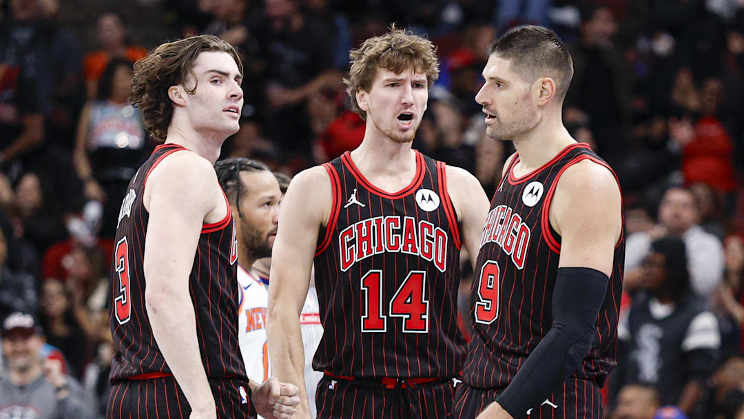Oct 31, 2025; Chicago, Illinois, USA; Chicago Bulls guard Josh Giddey (3), forward Matas Buzelis (14) and center Nikola Vucevic (9) celebrate during the second half of an NBA game against the New York Knicks at United Center. Mandatory Credit: Kamil Krzaczynski-Imagn Images