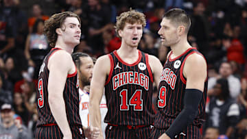 Oct 31, 2025; Chicago, Illinois, USA; Chicago Bulls guard Josh Giddey (3), forward Matas Buzelis (14) and center Nikola Vucevic (9) celebrate during the second half of an NBA game against the New York Knicks at United Center. Mandatory Credit: Kamil Krzaczynski-Imagn Images