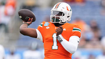 Dec 28, 2024; Orlando, FL, USA; Miami Hurricanes quarterback Cam Ward (1) warms up prior to the game against the Iowa State Cyclones at Camping World Stadium. Mandatory Credit: Jasen Vinlove-Imagn Images