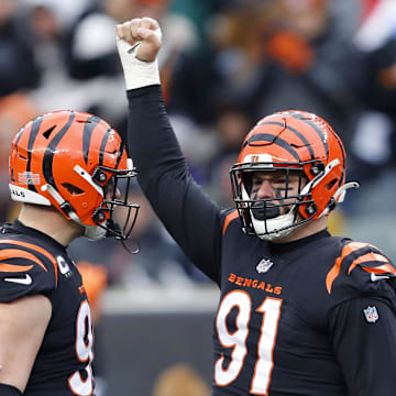 Jan 8, 2023; Cincinnati, Ohio, USA; Cincinnati Bengals defensive end Trey Hendrickson (91) celebrates the sack with defensive end Sam Hubbard (94) during the fourth quarter against the Baltimore Ravens at Paycor Stadium. Mandatory Credit: Joseph Maiorana-Imagn Images