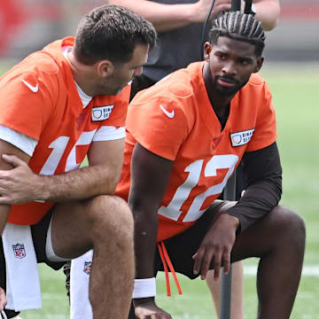 Cleveland Browns quarterback Joe Flacco (15) talks to quarterback Shedeur Sanders (12) during minicamp.