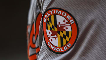 May 5, 2024; Cincinnati, Ohio, USA; The Baltimore Orioles logo on the sleeve of designated hitter Gunnar Henderson (2) as he prepares on deck during the seventh inning against the Cincinnati Reds at Great American Ball Park. Mandatory Credit: Katie Stratman-Imagn Images