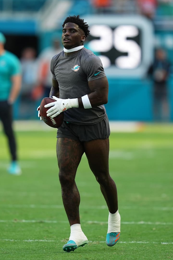 Miami Dolphins wide receiver Tyreek Hill warms up prior to the game against the New England Patriots. 