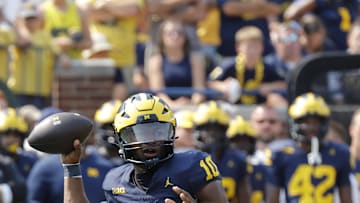 Sep 14, 2024; Ann Arbor, Michigan, USA;  Michigan Wolverines quarterback Alex Orji (10) throws against the Arkansas State Red Wolves during the second half at Michigan Stadium. Mandatory Credit: Rick Osentoski-Imagn Images