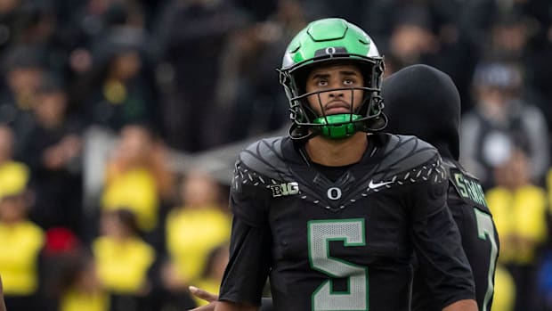 Oregon quarterback Dante Moore looks toward the scoreboard as the Oregon Ducks host the Indiana Hoosiers Oct. 11, 2025,