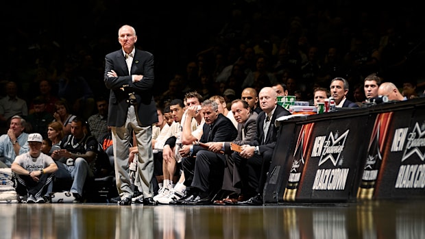 Gregg Popovich stands on the sideline during a Spurs game.