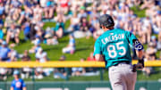 Mar 8, 2025; Mesa, Arizona, USA; Seattle Mariners infielder Colt Emerson (85) hits a home run in the top of the ninth during a spring training game against the Chicago Cubs at Sloan Park.
