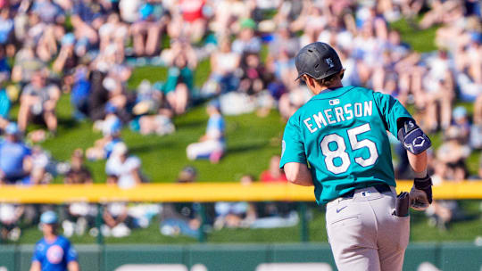 Mar 8, 2025; Mesa, Arizona, USA; Seattle Mariners infielder Colt Emerson (85) hits a home run in the top of the ninth during a spring training game against the Chicago Cubs at Sloan Park.