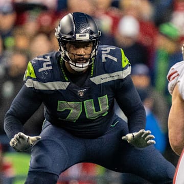 December 29, 2019; Seattle, Washington, USA; Seattle Seahawks offensive tackle George Fant (74) against San Francisco 49ers defensive end Nick Bosa (97) during the fourth quarter at CenturyLink Field.