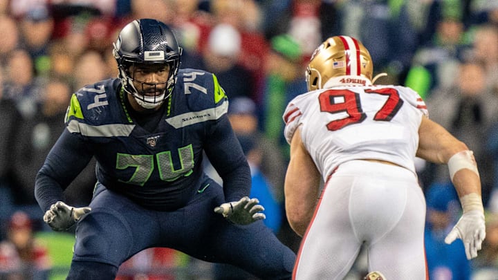 December 29, 2019; Seattle, Washington, USA; Seattle Seahawks offensive tackle George Fant (74) against San Francisco 49ers defensive end Nick Bosa (97) during the fourth quarter at CenturyLink Field.