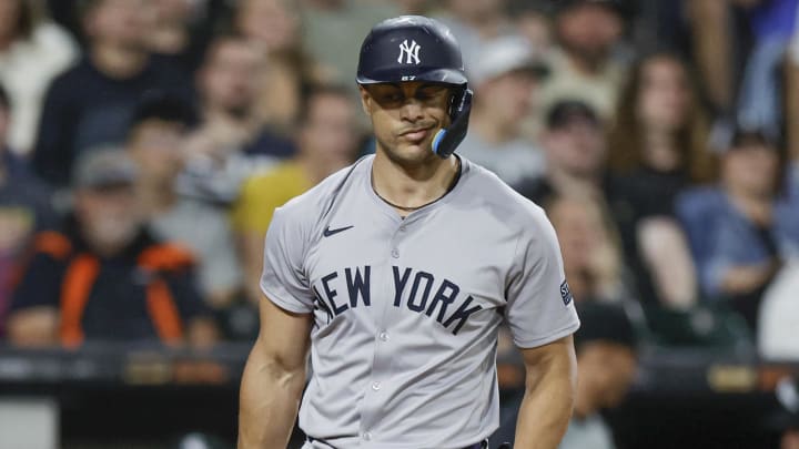 Aug 12, 2024; Chicago, Illinois, USA; New York Yankees designated hitter Giancarlo Stanton (27) reacts after striking out against the Chicago White Sox during the fourth inning at Guaranteed Rate Field. Mandatory Credit: Kamil Krzaczynski-USA TODAY Sports