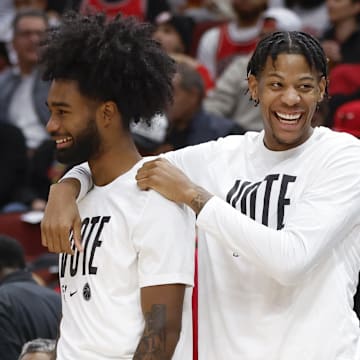 Nov 6, 2023; Chicago, Illinois, USA; Chicago Bulls guard Coby White (L) and forward Dalen Terry (R) joke on the sidelines during the first half at United Center. Mandatory Credit: Kamil Krzaczynski-Imagn Images