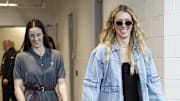 Indiana Fever guard Lexie Hull and guard Caitlin Clark arrive at Wintrust Arena before a game against the Chicago Sky. 