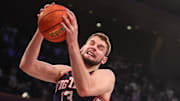 Nov 28, 2025; New York, New York, USA;  Illinois Fighting Illini center Tomislav Ivisic (13) grabs a rebound in the first half against the UConn Huskies at Madison Square Garden. Mandatory Credit: Wendell Cruz-Imagn Images