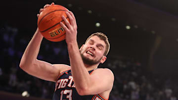 Nov 28, 2025; New York, New York, USA;  Illinois Fighting Illini center Tomislav Ivisic (13) grabs a rebound in the first half against the UConn Huskies at Madison Square Garden. Mandatory Credit: Wendell Cruz-Imagn Images