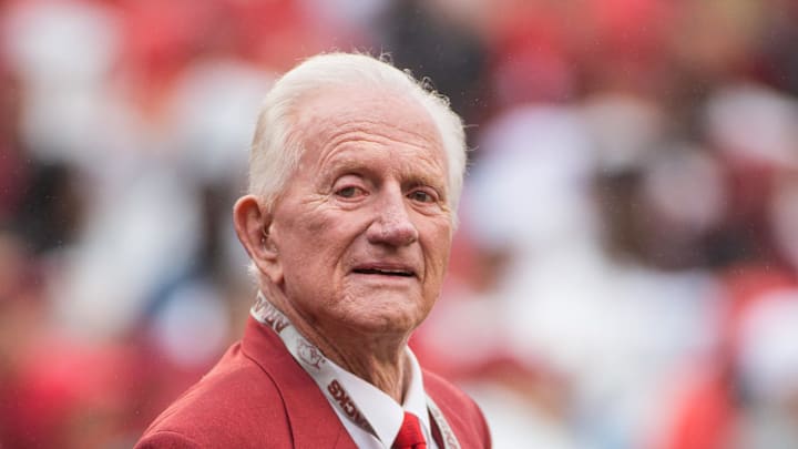 Arkansas Razorbacks former athletic director and coach Frank Broyles is honored with members of the 1964 national championship team before a game against the Alabama Crimson Tide at Donald W. Reynolds Razorback Stadium. Alabama defeated Arkansas 14-13.