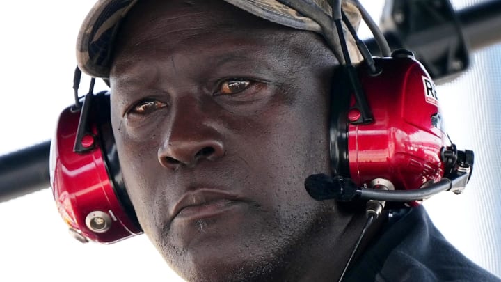 Oct 22, 2023; Homestead, Florida, USA; 23XI Team co-owner Michael Jordan sits atop of the pitbox during the 4EVER 400 presented by Mobil 1 at Homestead-Miami Speedway. Mandatory Credit: Jasen Vinlove-USA TODAY Sports