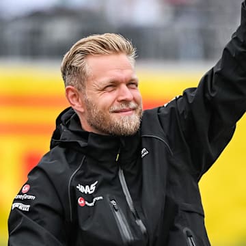 Jun 18, 2023; Montreal, Quebec, CAN; Haas F1 Team driver Kevin Magnussen (DEN) parades and salutes the crowd before the Canadian Grand Prix at Circuit Gilles Villeneuve. Mandatory Credit: David Kirouac-Imagn Images