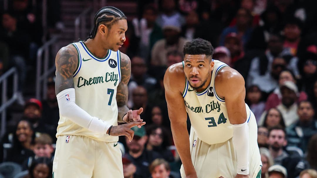 Jan 19, 2026; Atlanta, Georgia, USA; Milwaukee Bucks guard Kevin Porter Jr. (7) talks to teammate forward Giannis Antetokounmpo (34) during the game against the Atlanta Hawks during the fourth quarter at State Farm Arena. Mandatory Credit: Jordan Godfree-Imagn Images