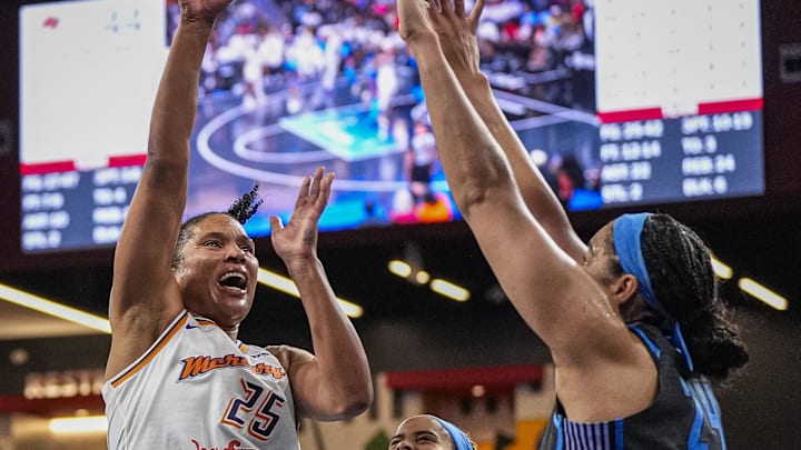 Aug 1, 2025; College Park, Georgia, USA; Phoenix Mercury forward Alyssa Thomas (25) shoots over Atlanta Dream forward Brionna Jones (24) during the second half at Gateway Center Arena at College Park. Mandatory Credit: Dale Zanine-Imagn Images
