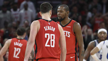 Nov 16, 2025; Houston, Texas, USA; Houston Rockets center Alperen Sengun (28) reacts with forward Kevin Durant (7) after making a basket during overtime against the Orlando Magic at Toyota Center. Mandatory Credit: Troy Taormina-Imagn Images