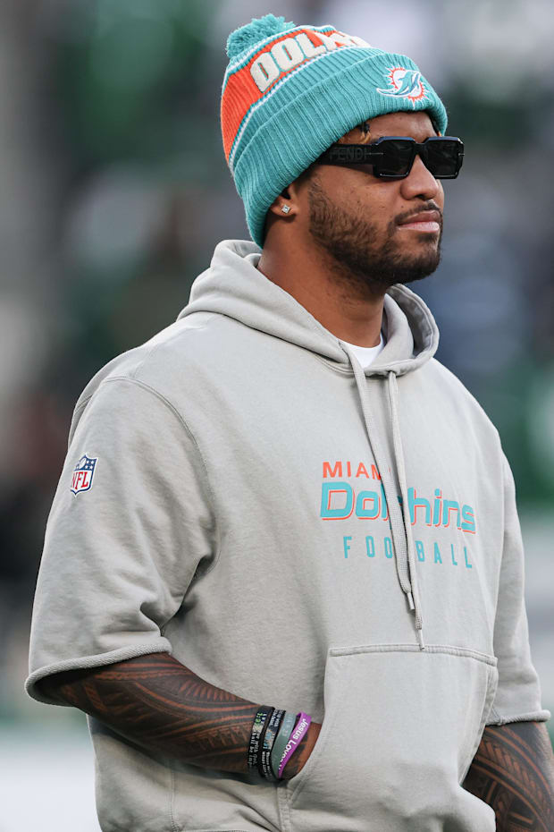 Miami Dolphins quarterback Tua Tagovailoa on the field before the game against the New York Jets