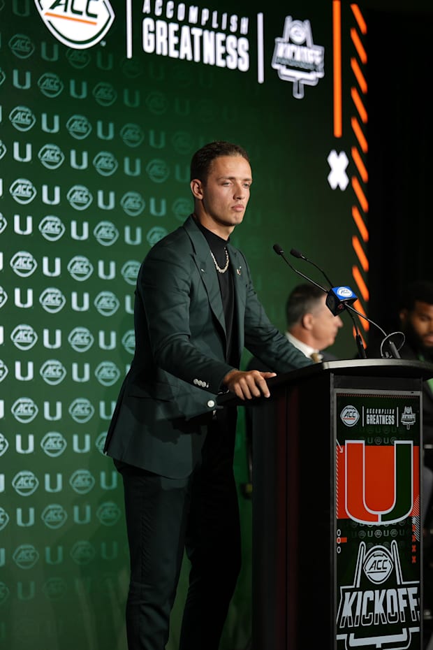 Jul 22, 2025; Charlotte, NC, USA; Miami quarterback Carson Beck answers questions from the media during ACC Media Days at Hil