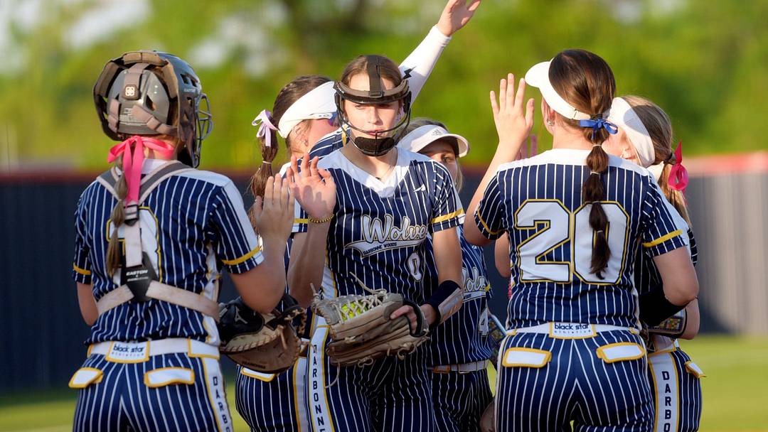 D'Arbonne Woods pitcher Aubrey Zachry surrounded by teammates