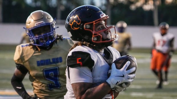 Cocoa's Jayvan Boggs makes the catch for second quarter touchdown during a game with Mainland at Daytona Stadium in Daytona B